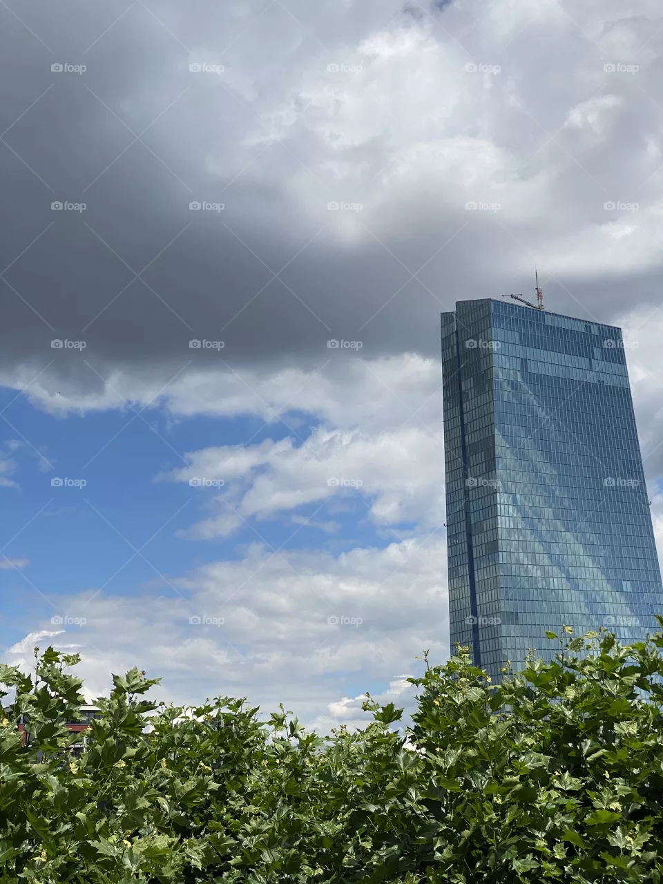 European Central Bank Building with one dark cloud over the top