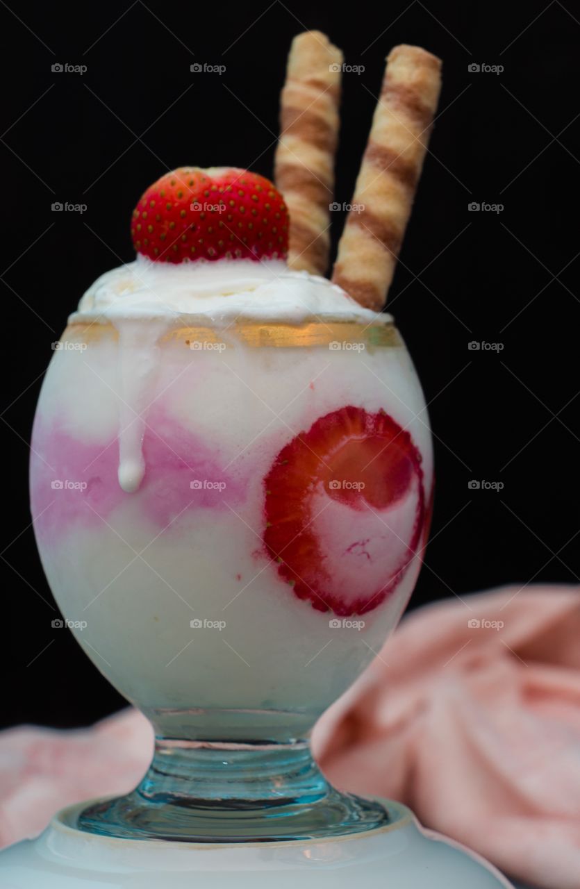 Vanilla and Strawberry Ice Cream with strawberry pieces and chocolate biscuits