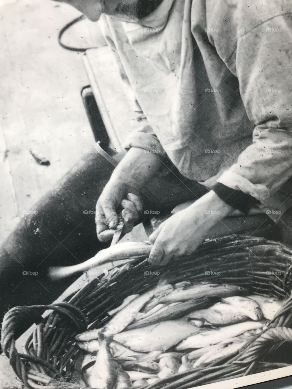 Fishmonger at work in the early 20th century.