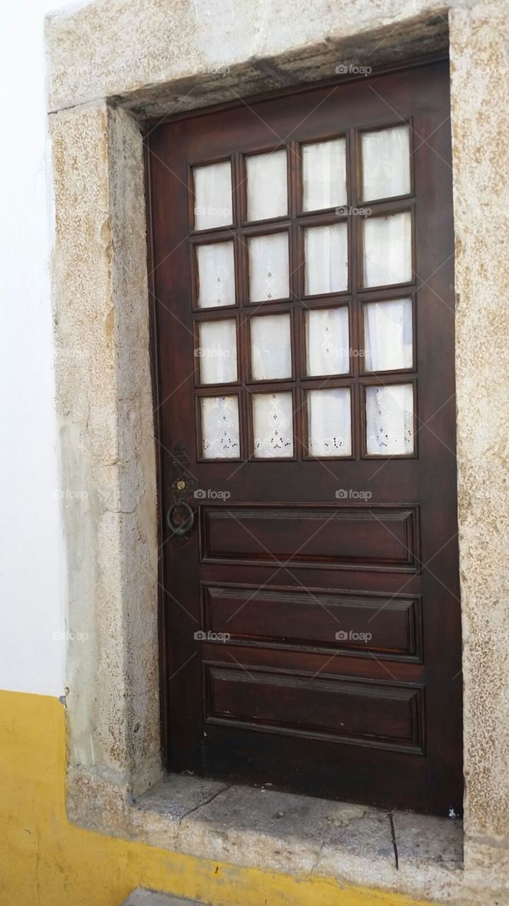 Brown door in old house  at Obidos