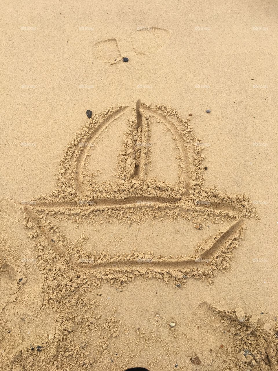 Boat drawn in the sand