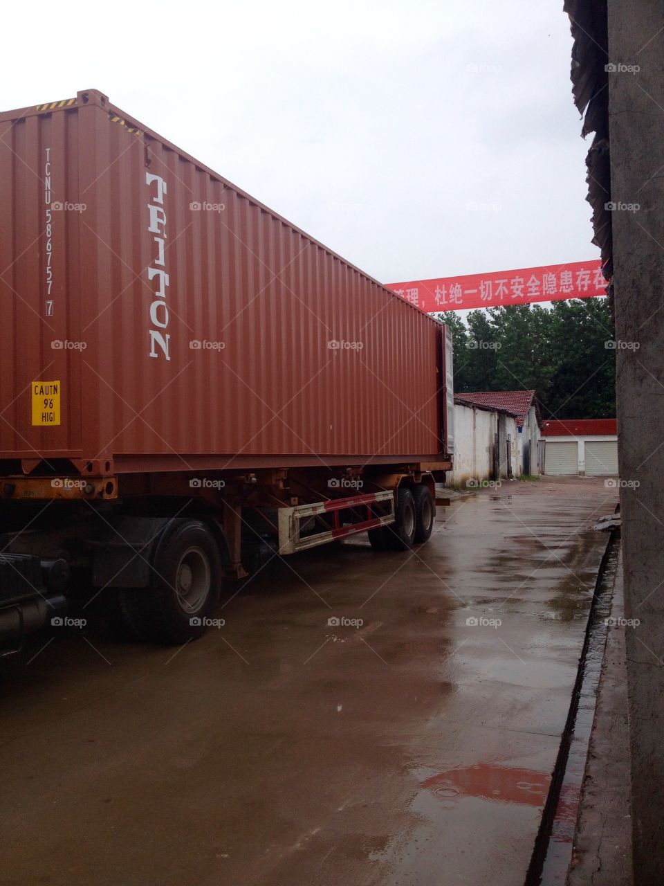 Container parked near a warehouse