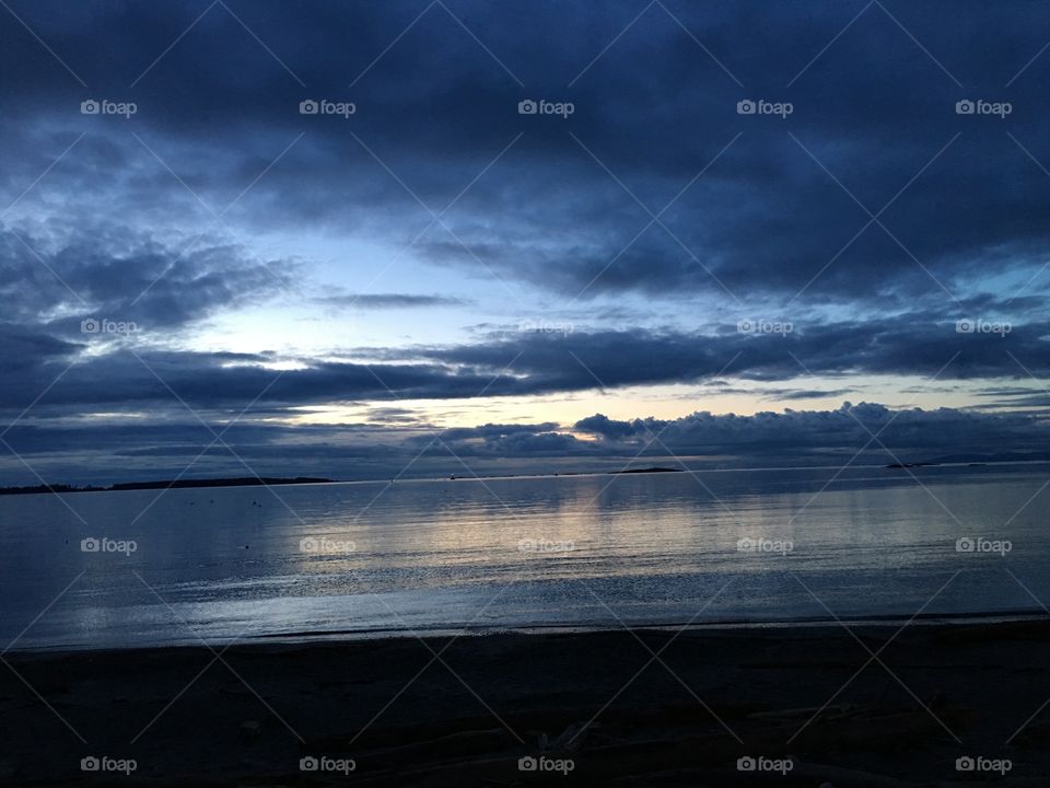 Scenic view of storm cloud over sea