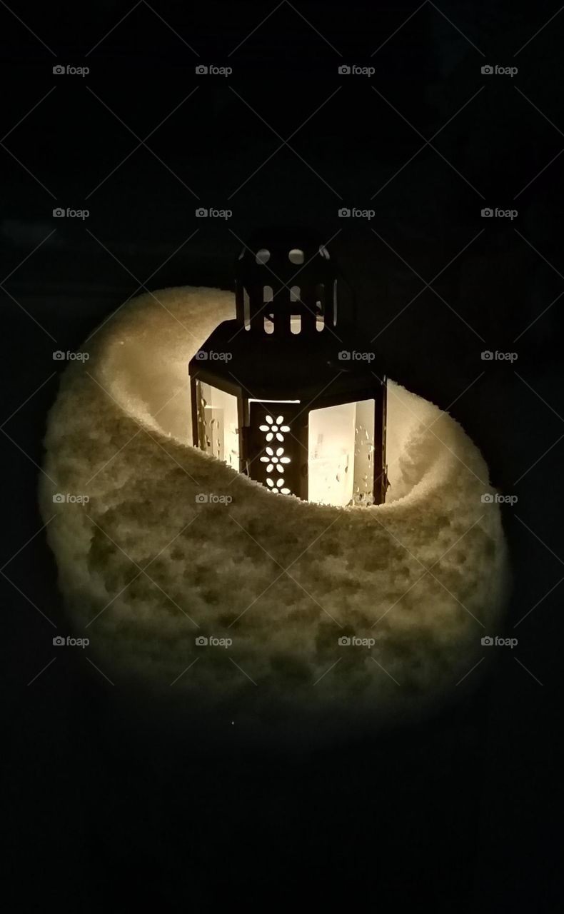 Candle lantern in the snow