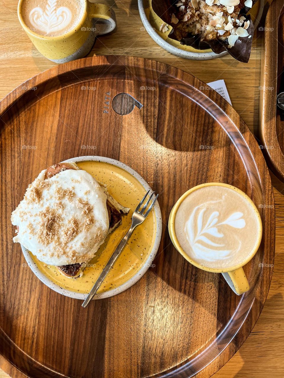 Coffee and delicious cinnamon roll, served at  a local restaurant. Coffee break.