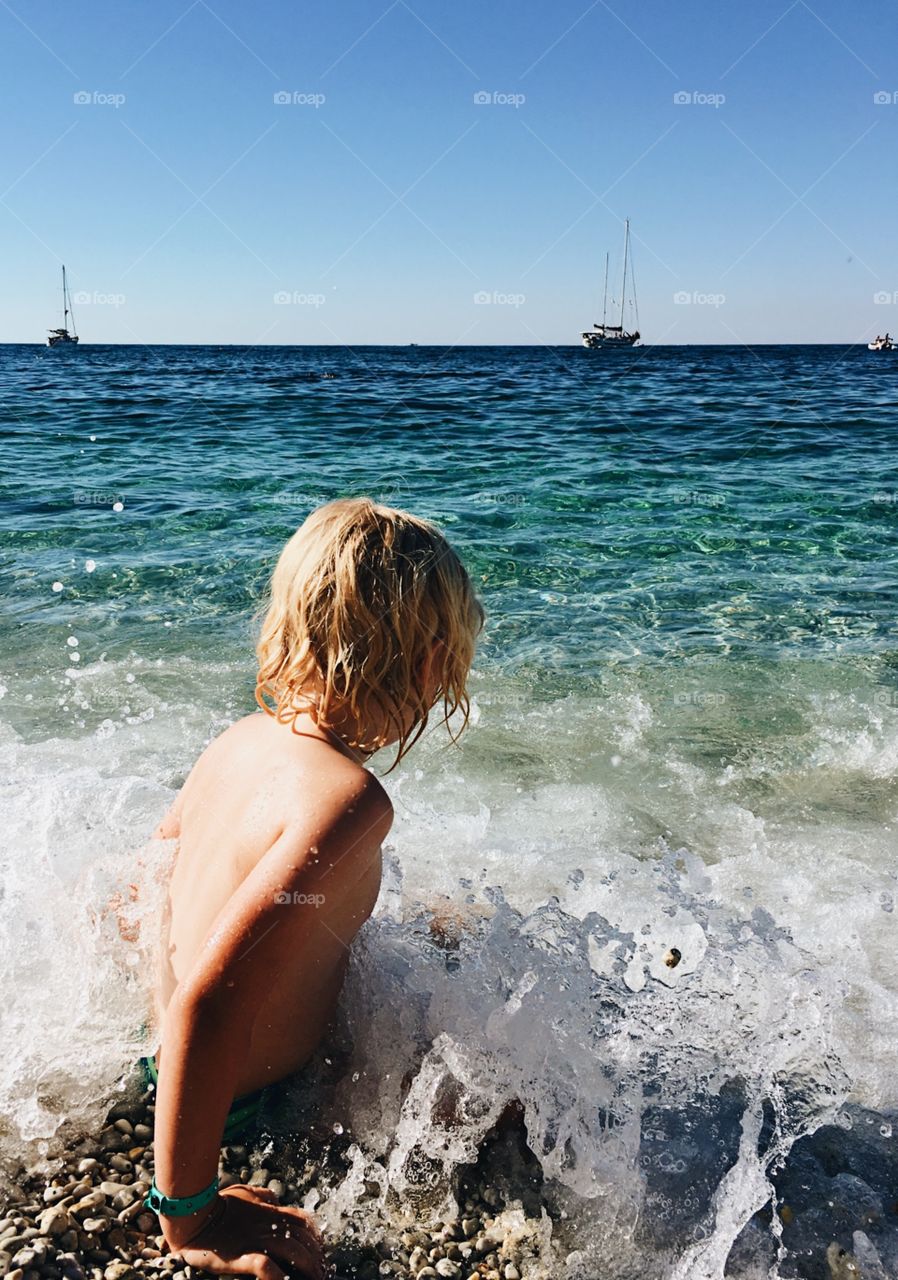 Child splashing in the water