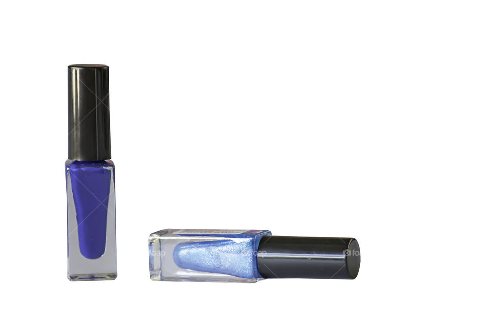 Blue bottle of nail polish on a white background.