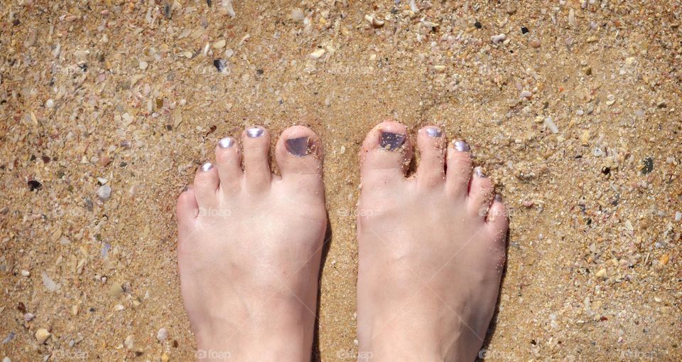 Beautiful feet at the beach