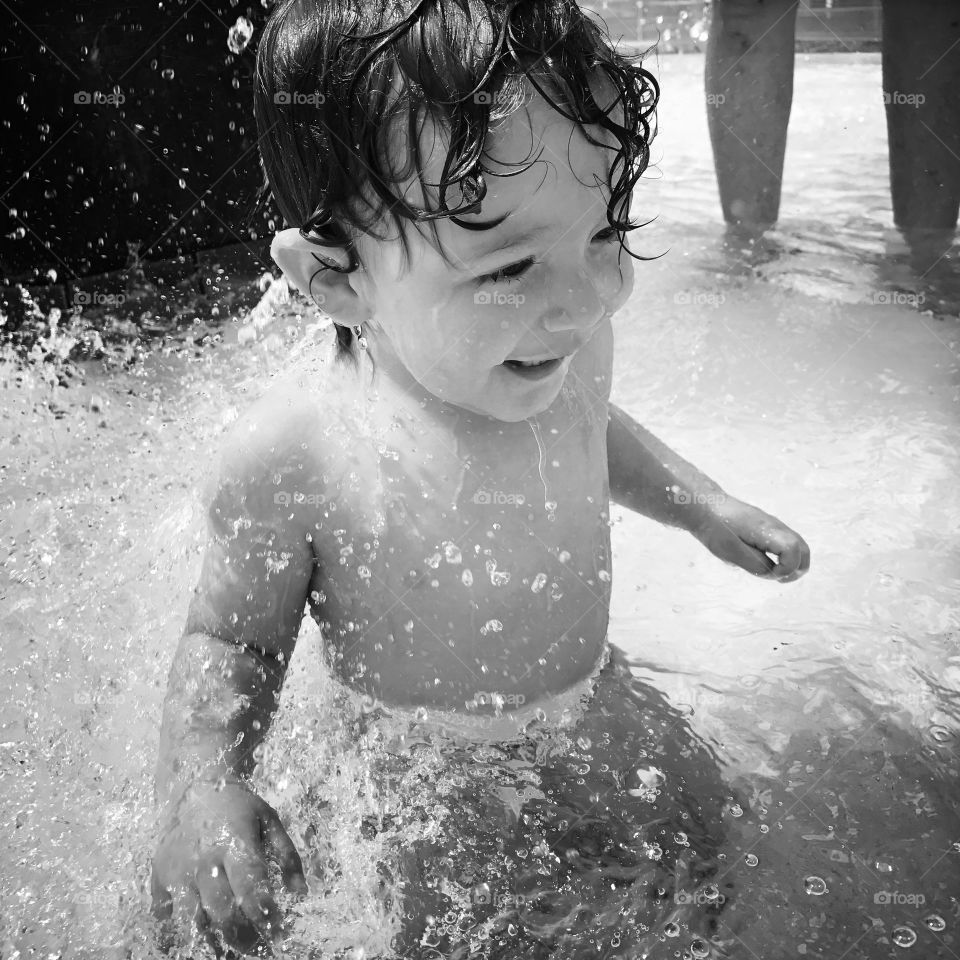Small child swimming in resort
