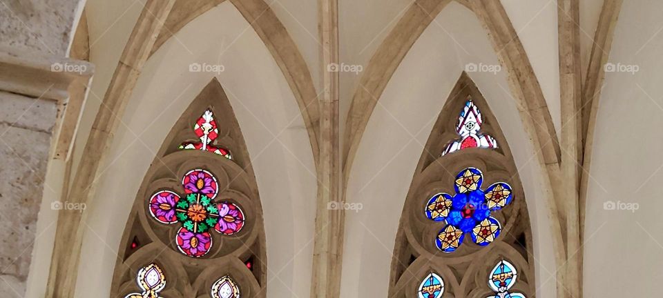 These beautiful stain glass windows with their intricate multifaceted multicolor rosetta shapes at “St. Katharinenkirche” or “St. Katharine’s Church” in “Regensburg”, Germany are exciting to look at and take in. 2023. Hypnotic Productions