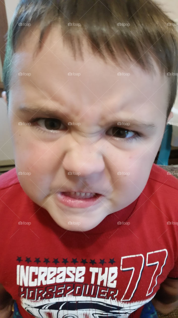 Portrait of a boy making face