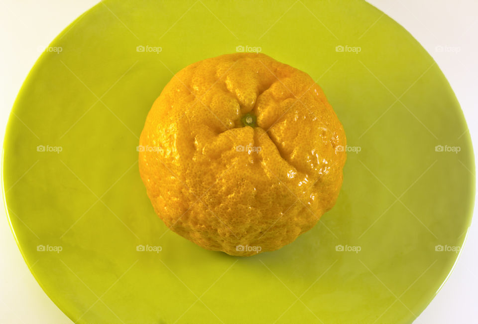 Top view of tangerine on plate