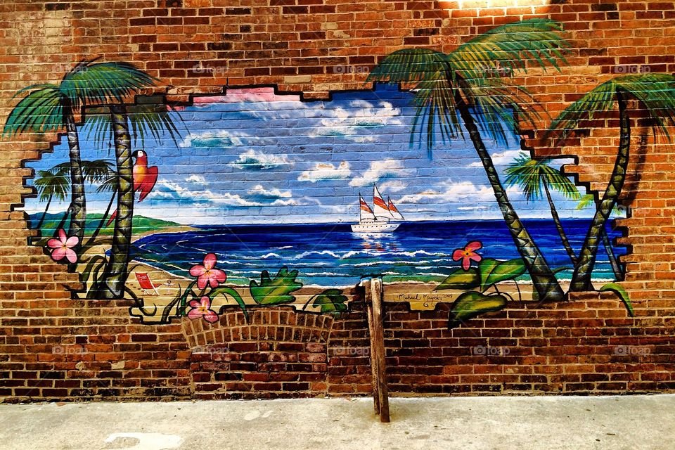 Painted scene on brick wall 