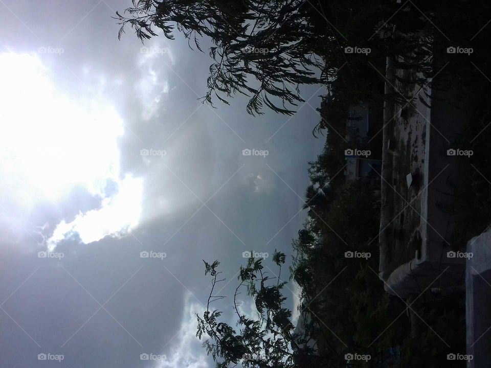 sun light escaping through clouds