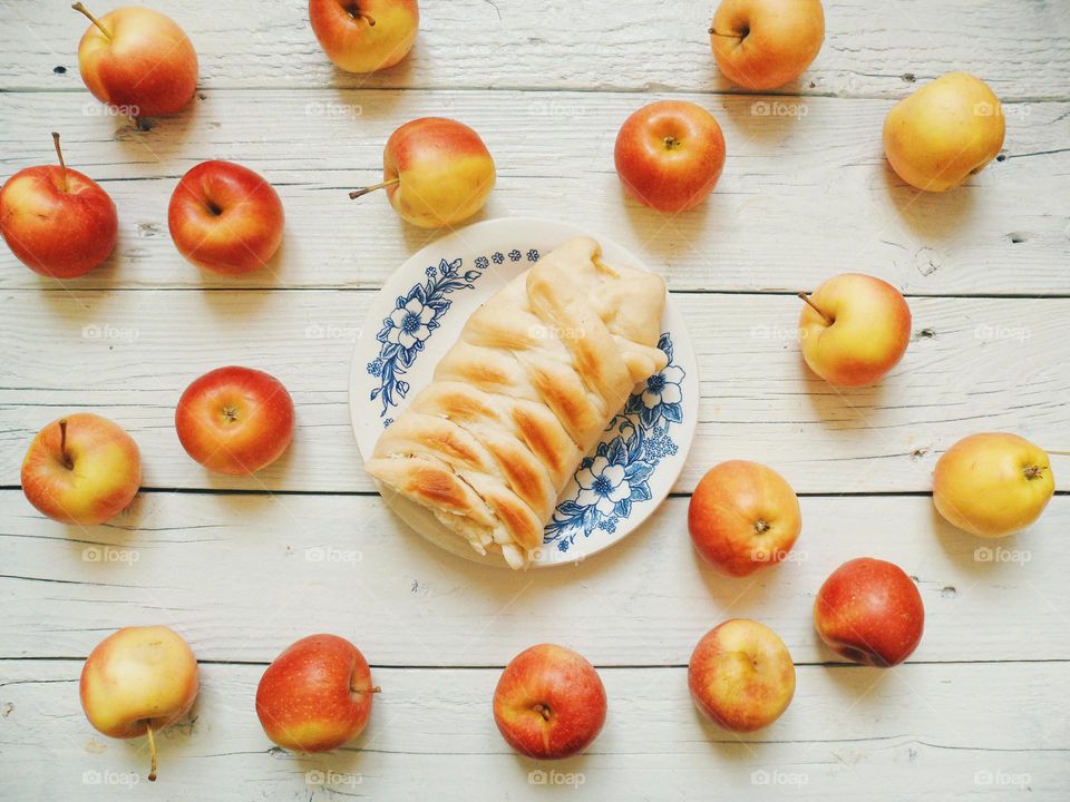 Close-up of apple pie and apples