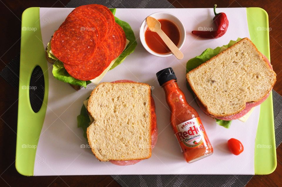 Making a sandwich with Frank's Red Hot sauce