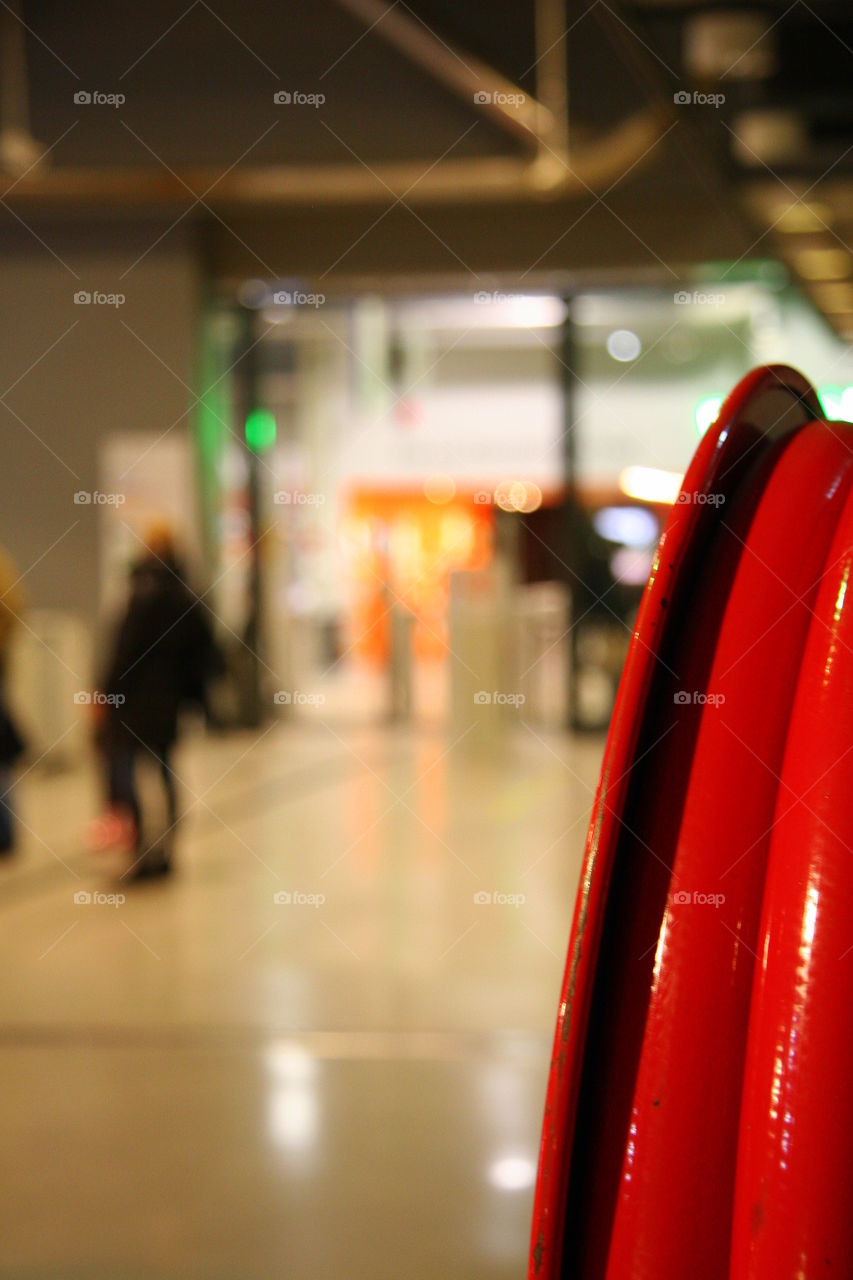 red structure with people silhouette