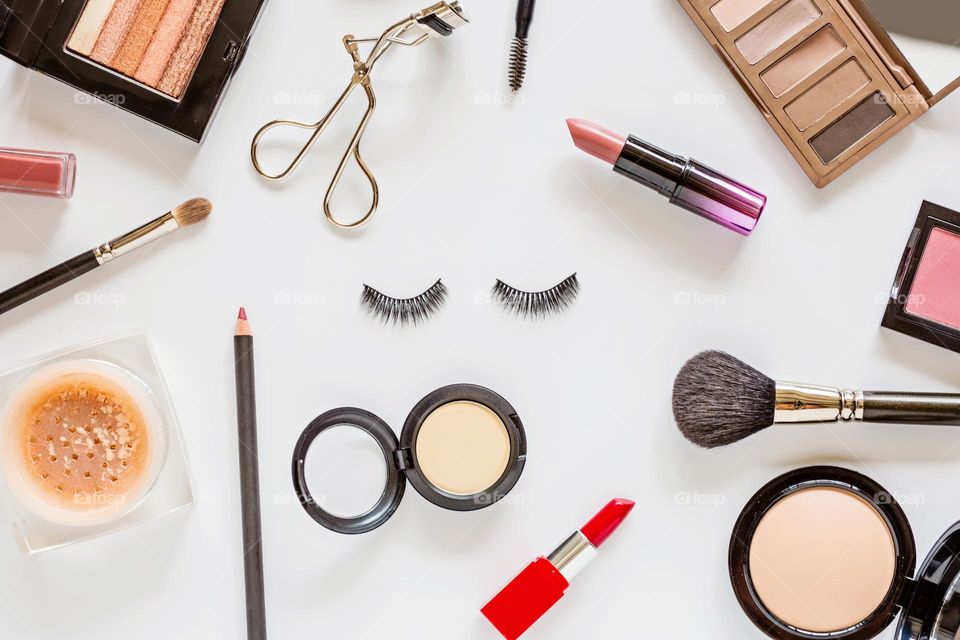 Flat lay of beauty products on white background 