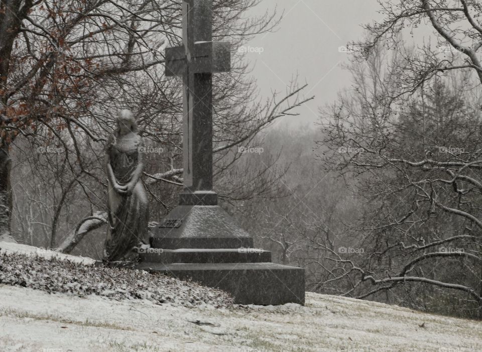 Snowy cold day in the cemetery 