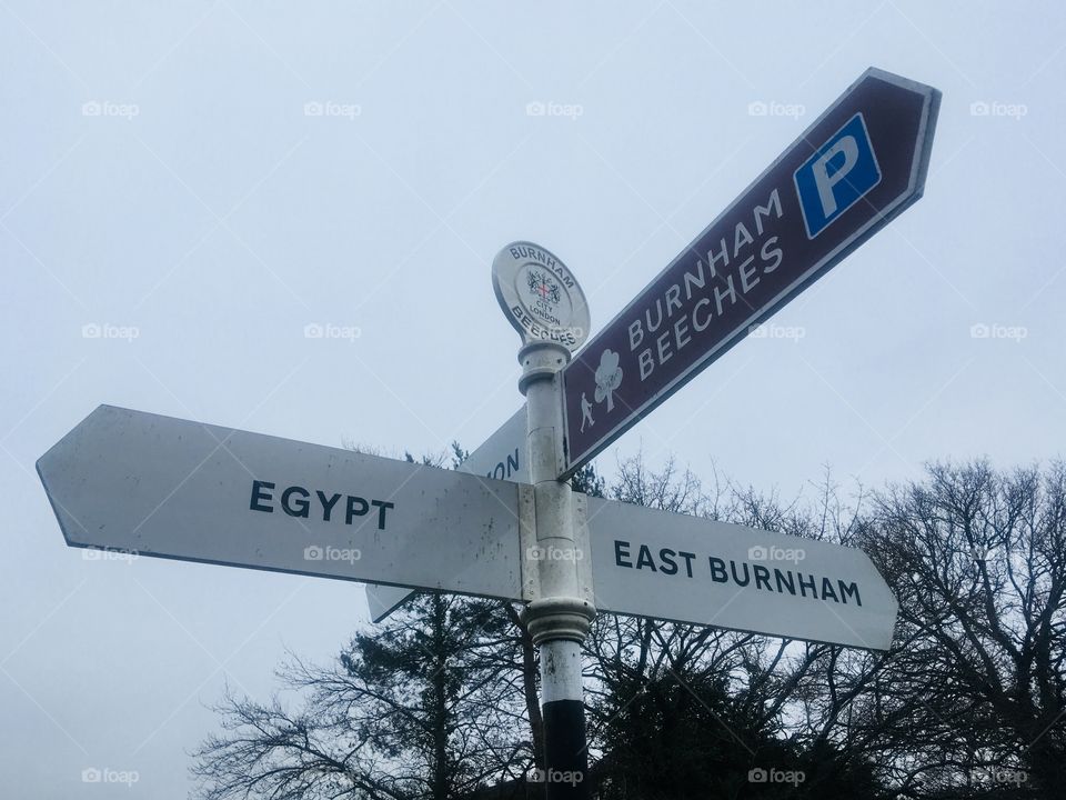Signpost near Burnham Beeches, Buckinghamshire, showing Egypt to the left, in Spring.