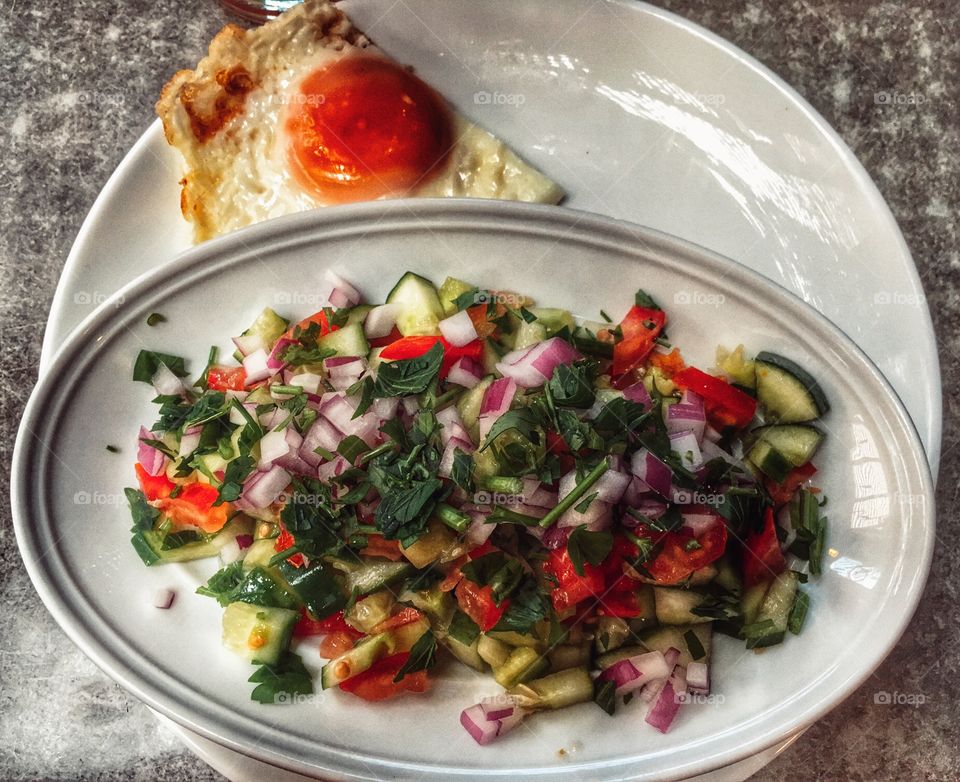 Fried egg with fresh seasonable salad