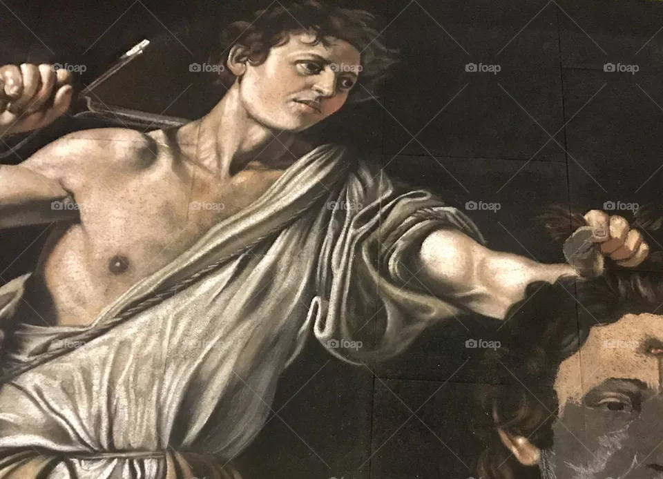 David with the Head of Goliath by Carvaggio an unfinished reproduction in chalk. I came across this street artist prepping his work for the next day.
