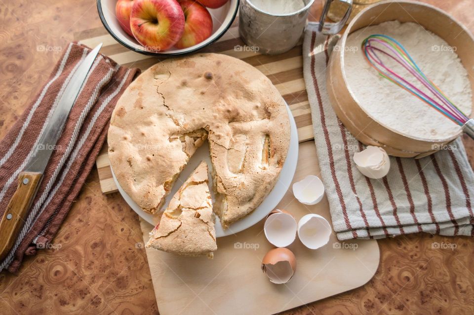 Making homemade puffed apple pie with eggs, sugar and flour.