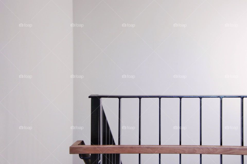 White staircase with black railing
