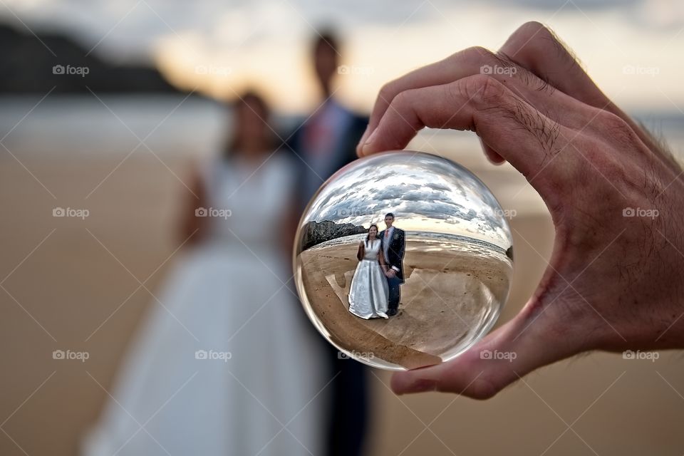 Just married couple trough a crystal ball 