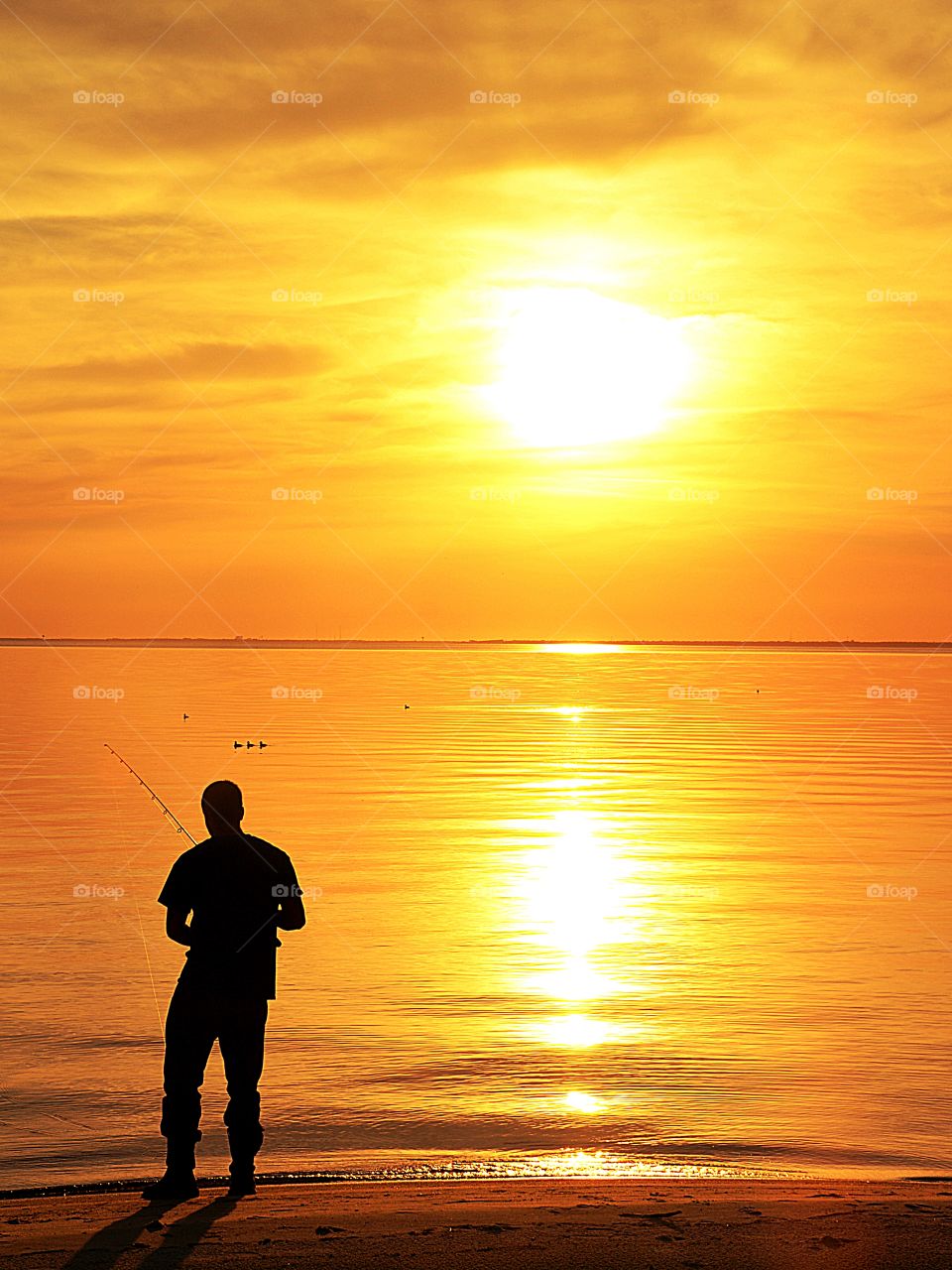Fisherman enjoying the sunset