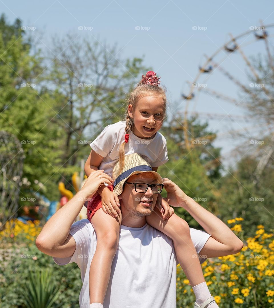 Happy father and daughter outdoors having fun