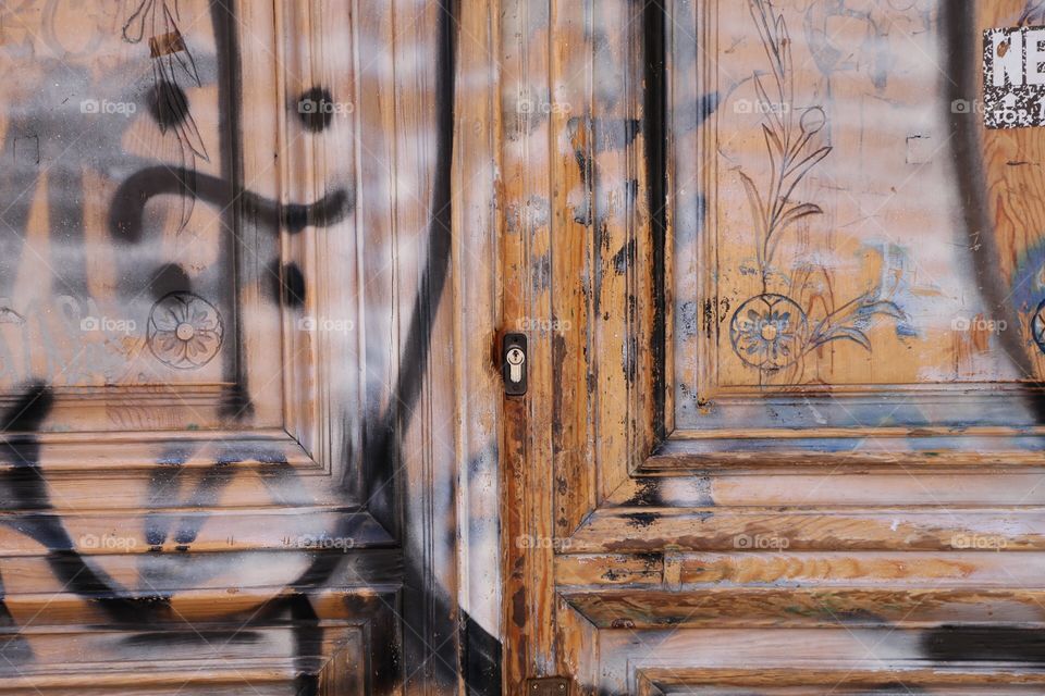 Graffitied wooden doors