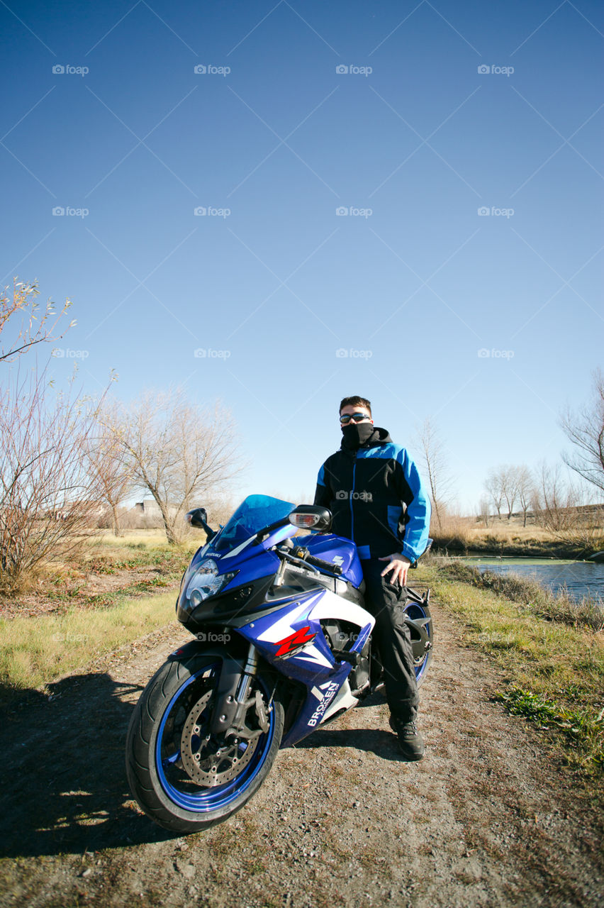 Motorcycle rider sitting on his bike