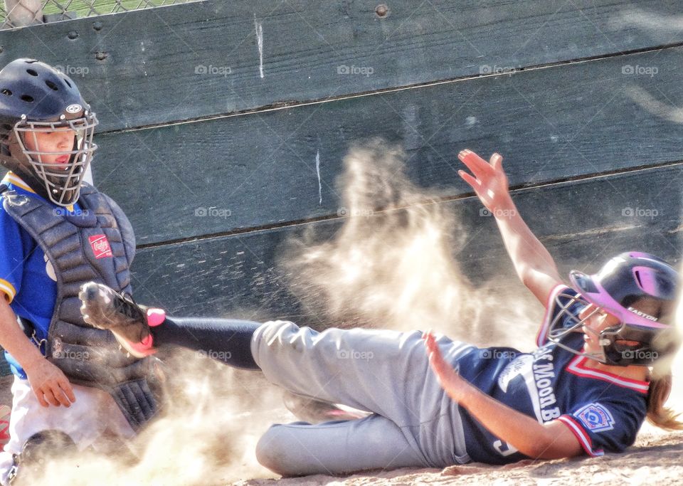 Girl Playing Baseball Sliding Into Homebase