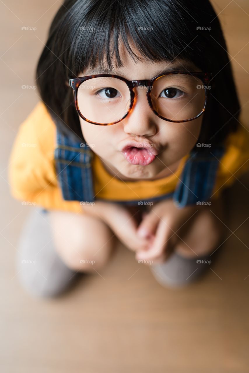 a girl wearing glasses