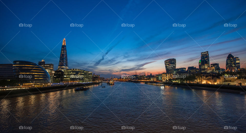 View over the city of London in sunset from Tower bridge.