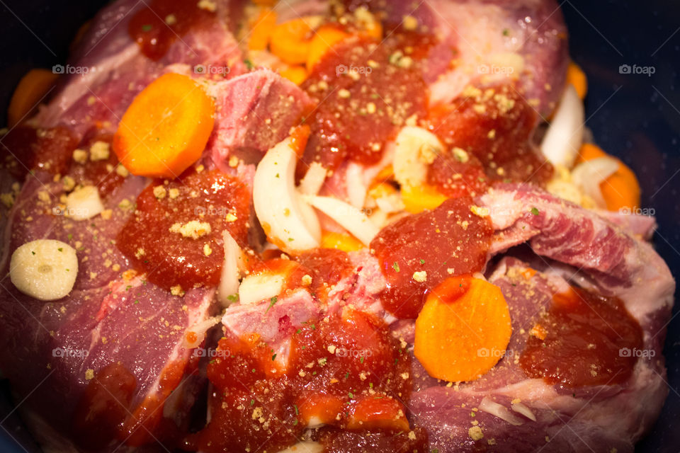 Ingredients for a red meat meal, potatoes, garlic, tomato juice, Onion, carrots, salt, spices