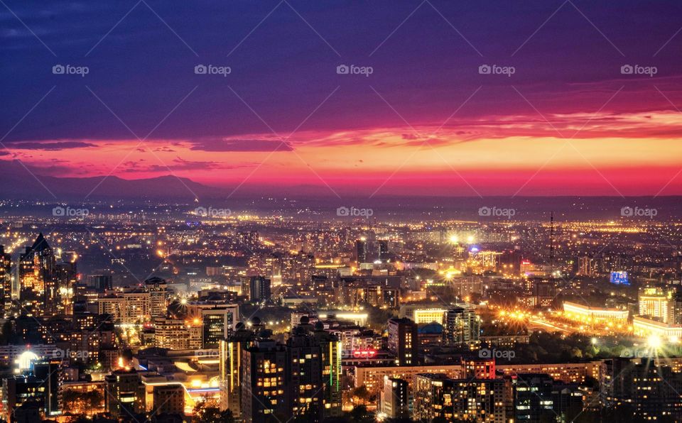 Beautiful Almaty city light scape on twilight sky , Koktobe hill , Kazakhstan 