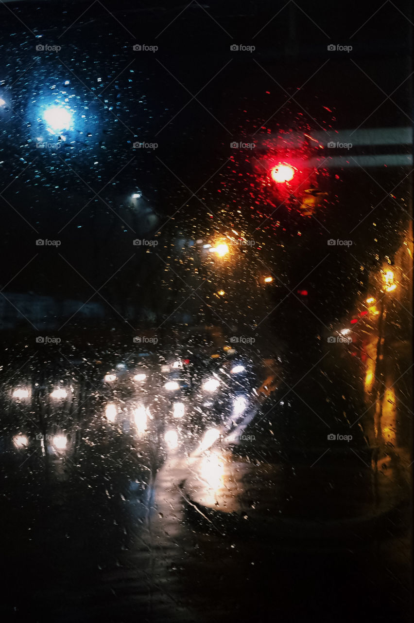 The city lights through a rainy bus window. Cold city night, rainy night, moody, Lo-fi.