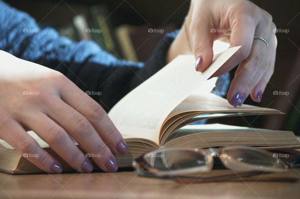 Girl leafing through a book