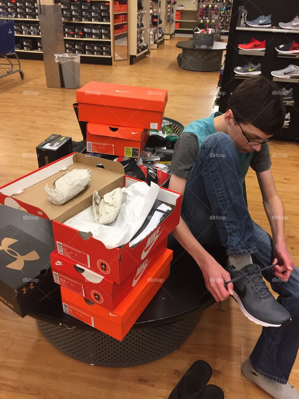Boy trying on shoes 