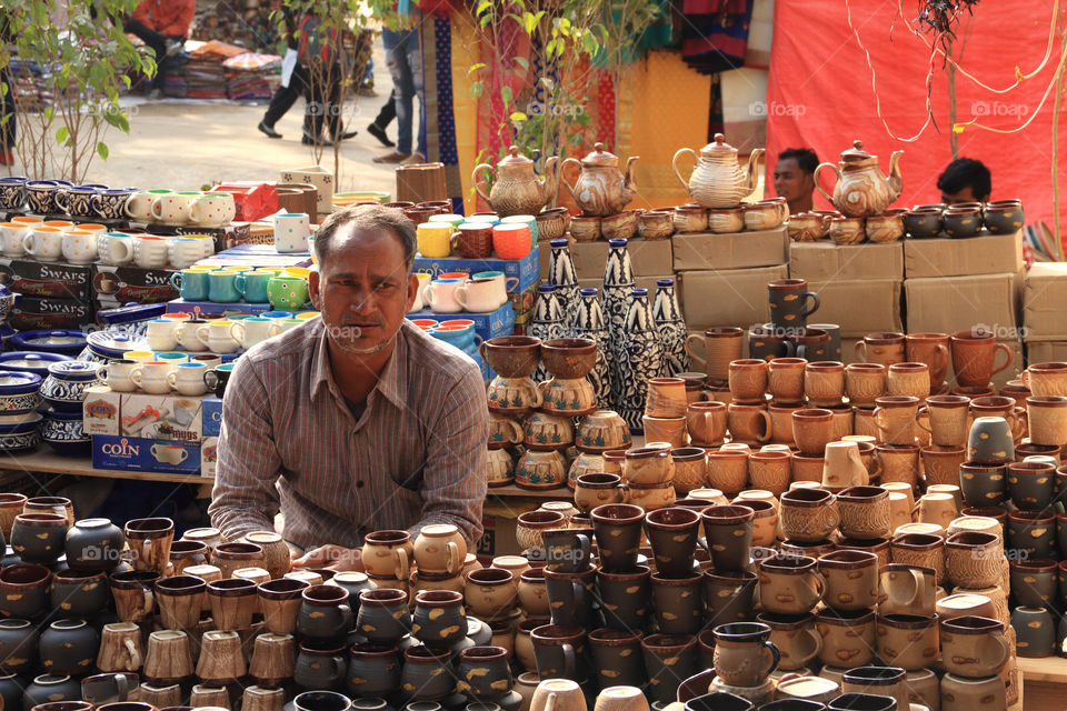 Faridabad, Haryana, India - Crockery seller at the Surajkund Crafts Mela