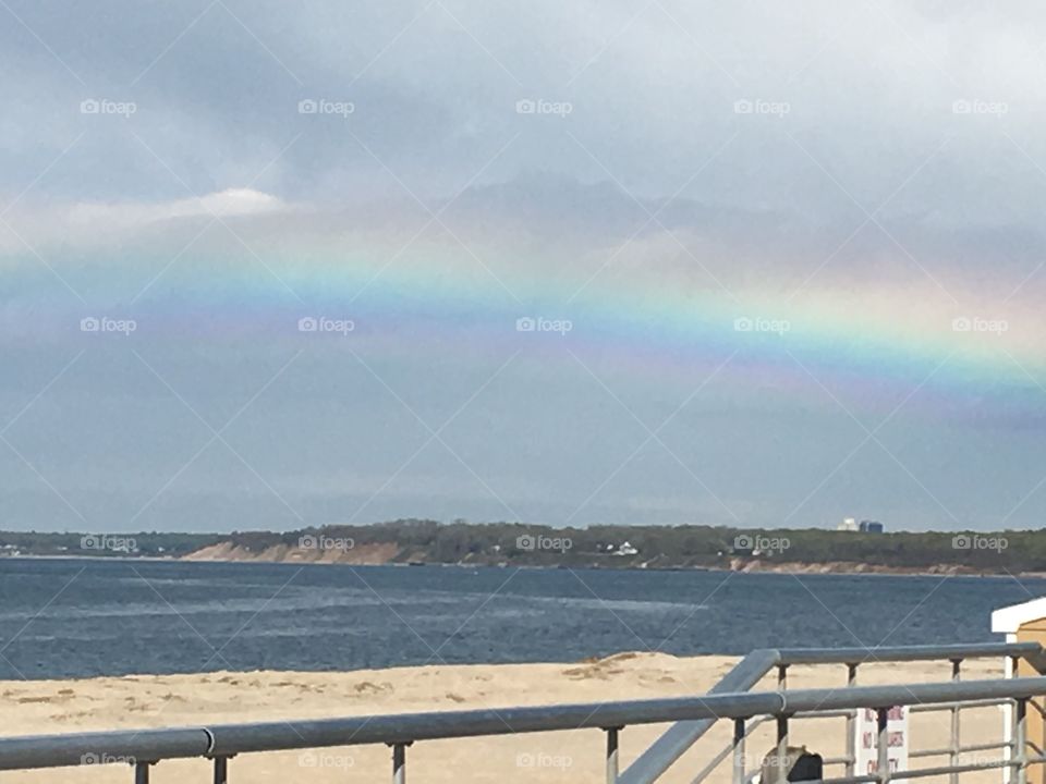 A Rainbow at the beach after a rain storm.