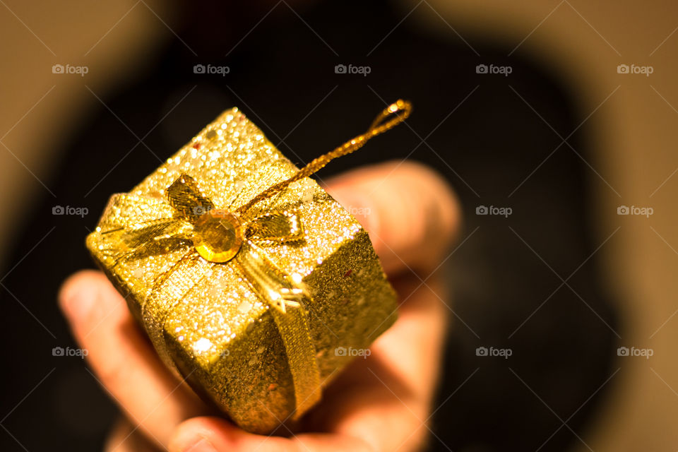 Man Giving Golden Gift
