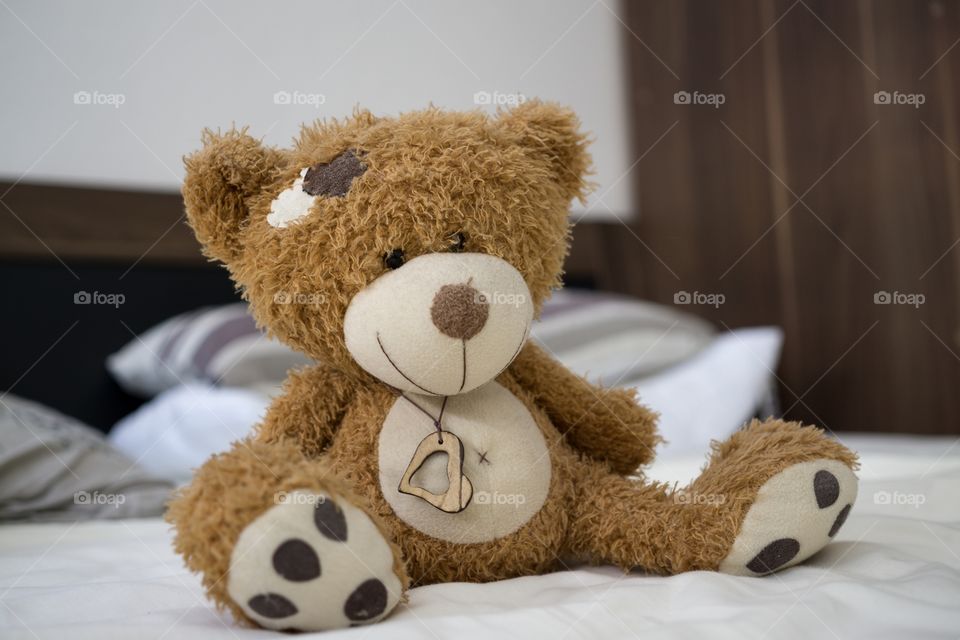 Teddy bear on a bed