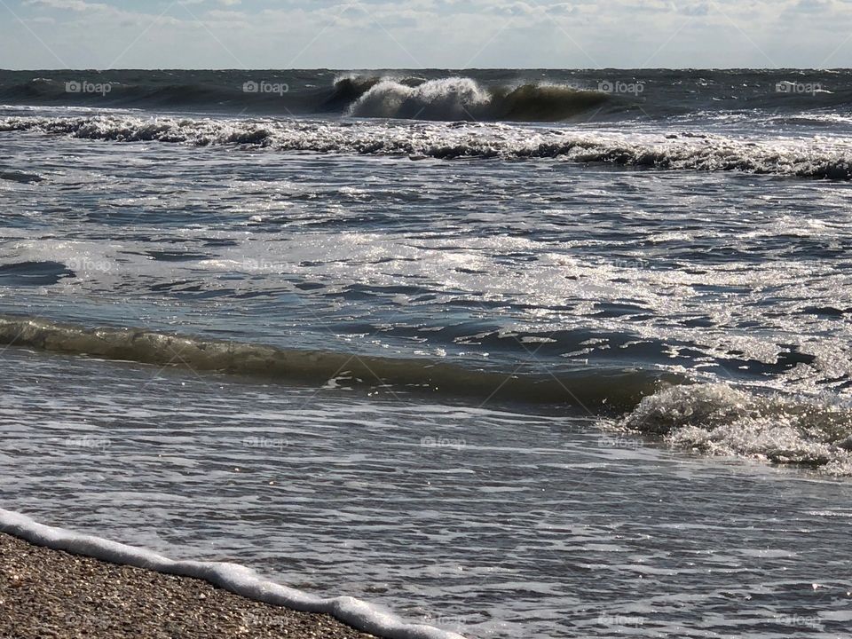 Soft waves rolling onto the beach.