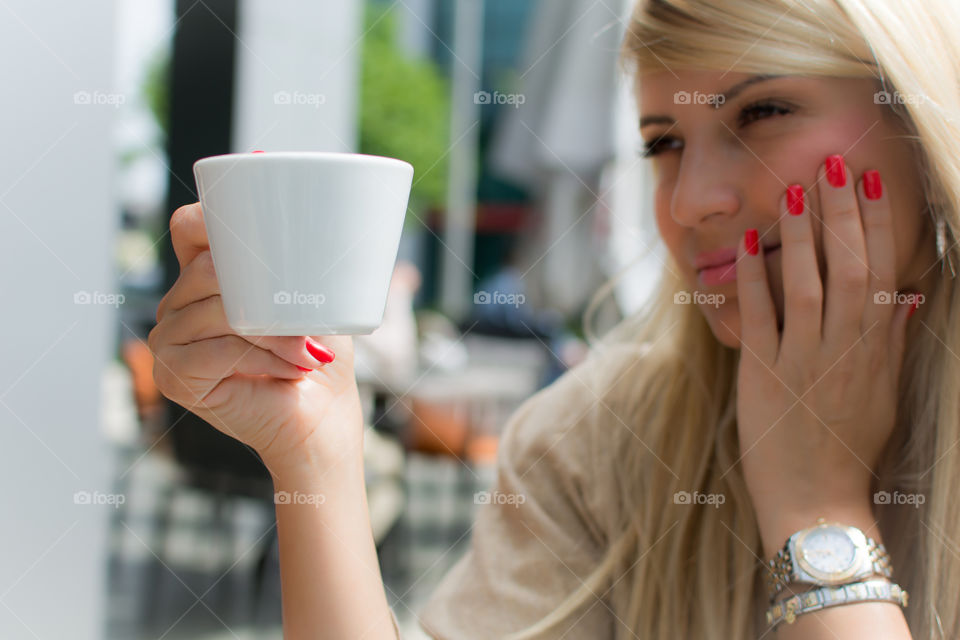 Beautiful woman holding cup