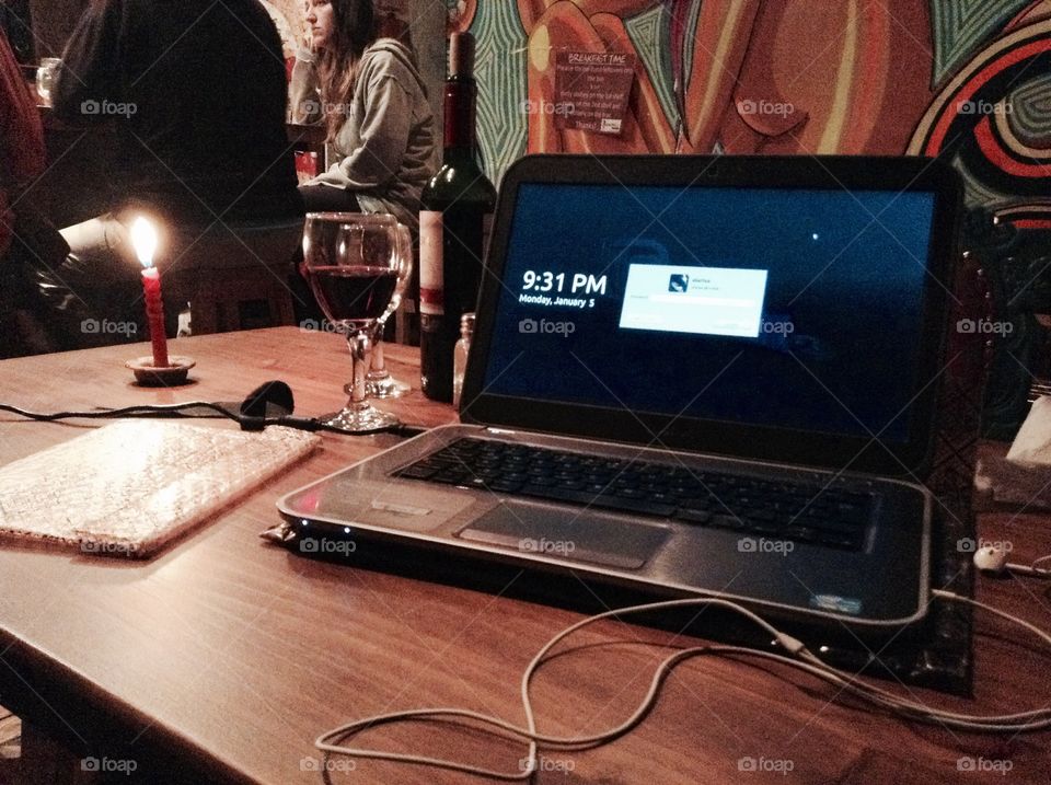 Working at hostel. Candles night, wine and live music in the hostel is just enough to finish that work.