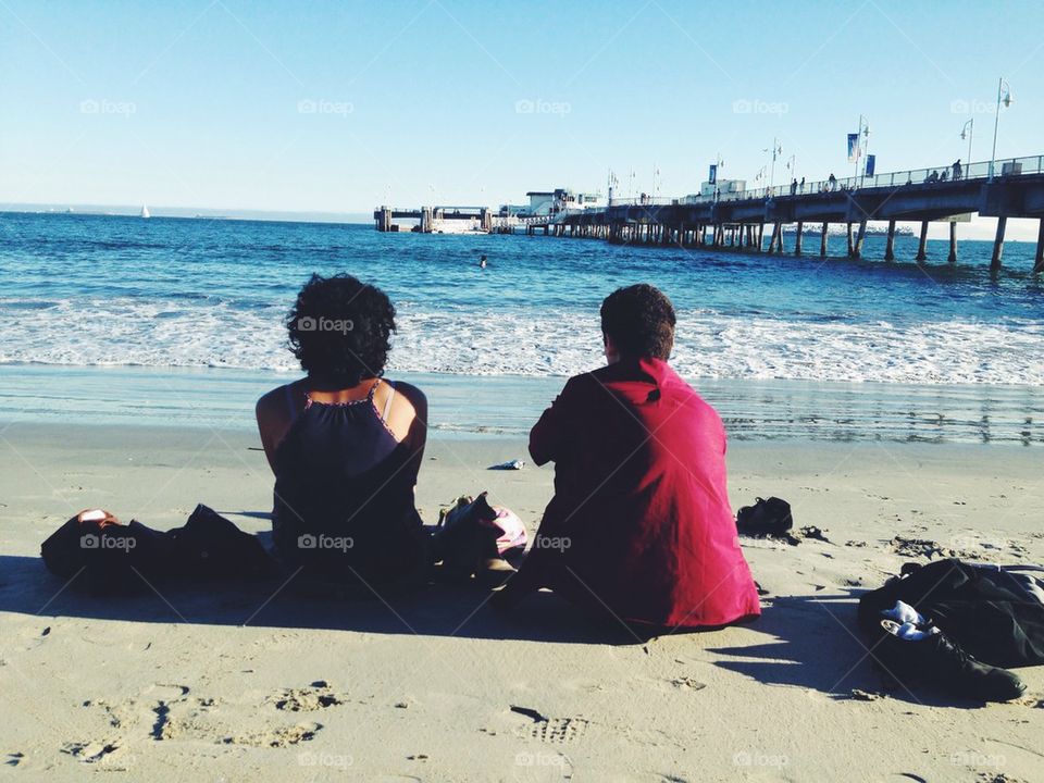 Couple sitting on beach