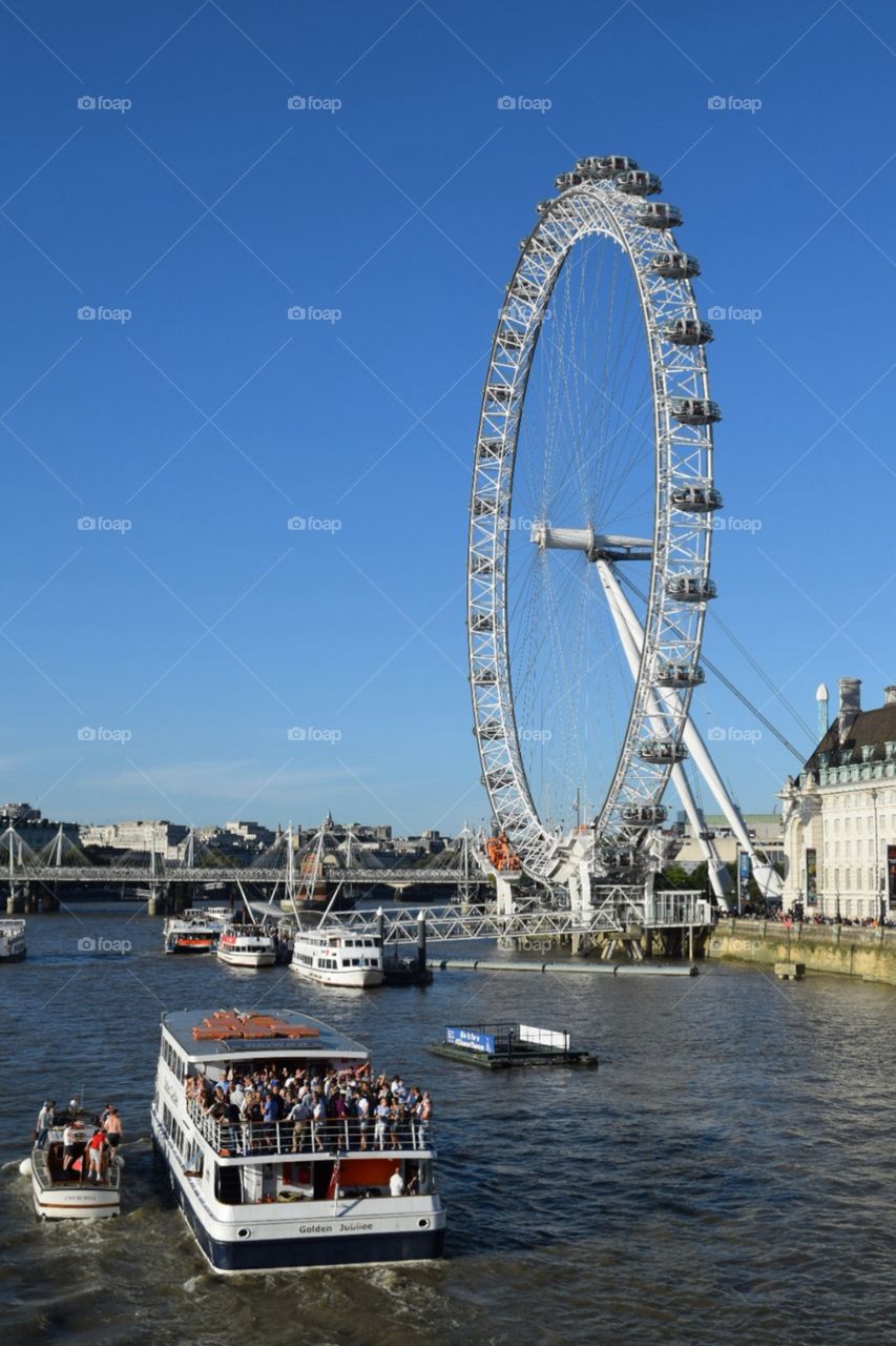 The London eye ferris wheel River Thames